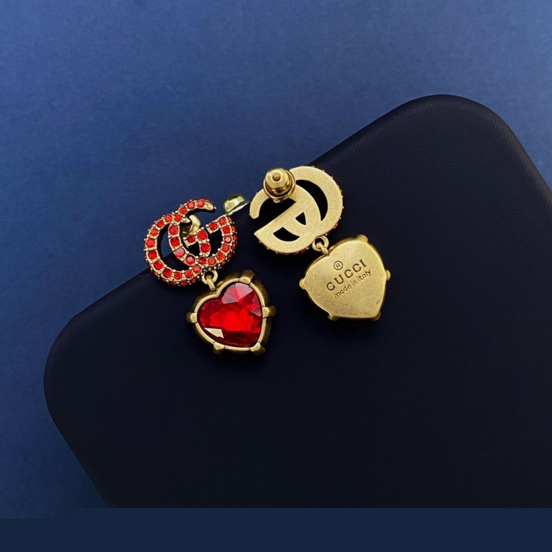 G*u*i earrings